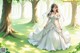 A woman in a wedding dress walking through a forest.