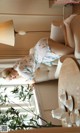 A woman laying on a couch in a living room.